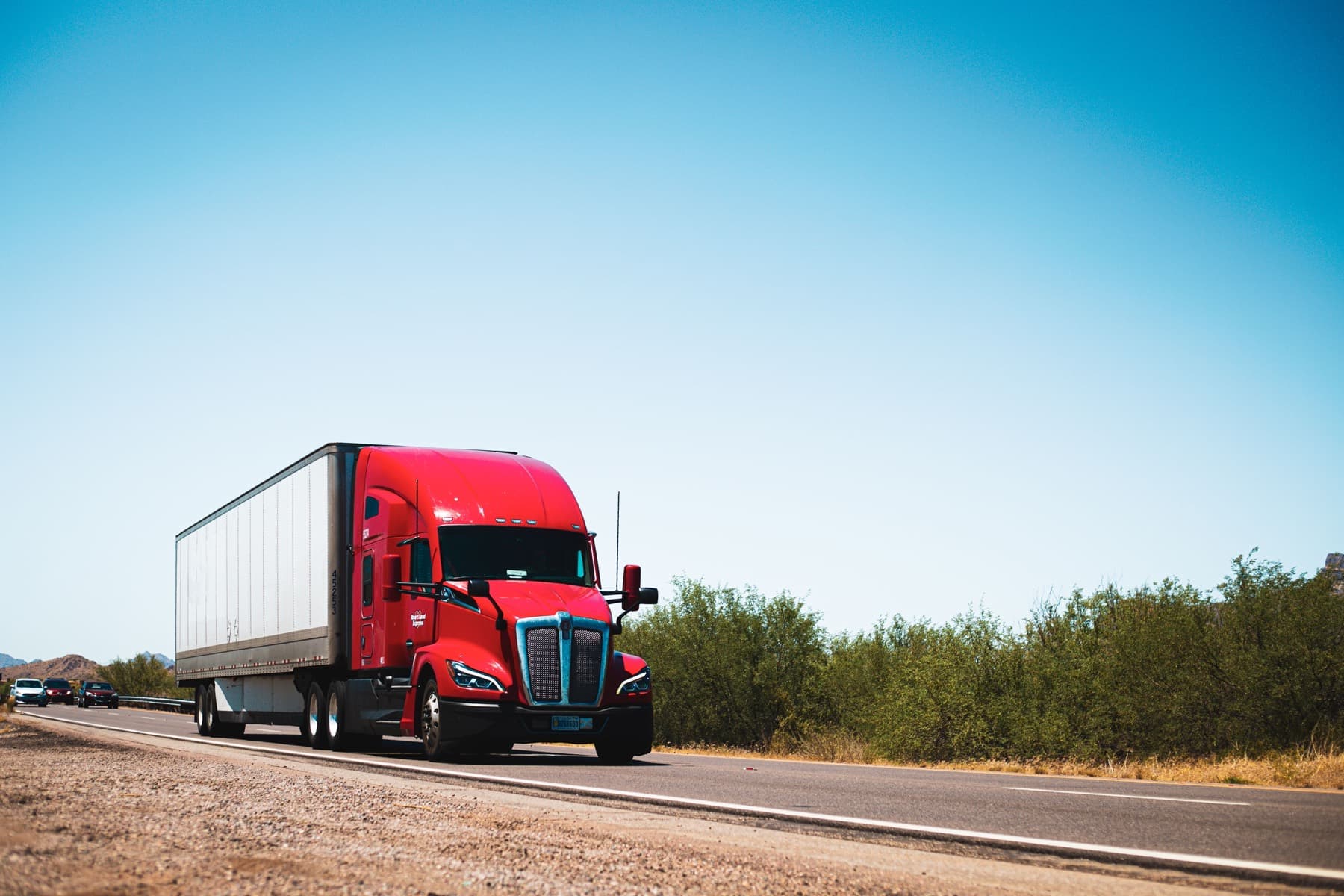 Tractor-trailer running an open highway at speed